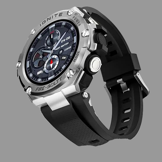 Black and silver smartwatch on a rocky surface with a gray background